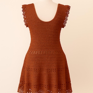 Back view of a handmade summer crochet dress featuring a scoop neckline and a flared lace skirt, crafted using a crochet summer dress pattern.