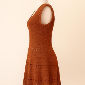 Side view of a handmade summer crochet dress featuring a fitted bodice and flared lace skirt, created using a crochet summer dress pattern.