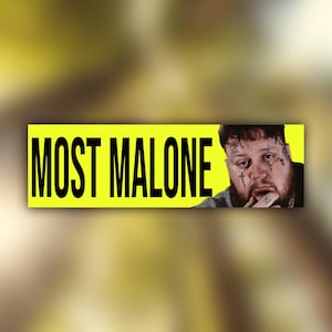May include: A rectangular sticker with the text "MOST MALONE" in bold black letters on a bright yellow background. The image includes a portrait of a man with face tattoos.