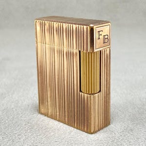 Vintage S.T. Dupont Ligne 1 Feuerzeug: Goldene Gugeldrehscheibe, französisches Sammlerstück der 70er Jahre