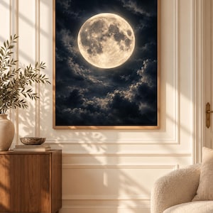 May include: A rectangular wall art print featuring a large, luminous full moon centered against a dark, cloudy night sky. The moon displays detailed craters and textures in shades of cream and white, contrasting with the deep navy blue clouds.