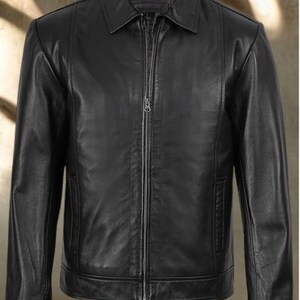 May include: A black leather jacket with a collared neckline and a full-length zipper closure. The jacket features long sleeves, a tailored fit, and a classic design. The jacket has a pocket on each side.
