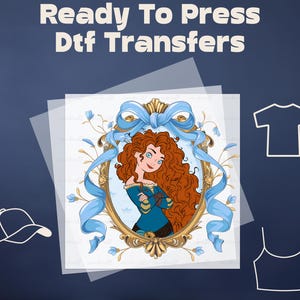 May include: DTF transfer design featuring a cartoon woman with red curly hair, framed in gold with blue ribbons and floral accents. The text "Ready To Press Dtf Transfers" is at the top. Includes outlines of a t-shirt, tank top, and baseball cap.