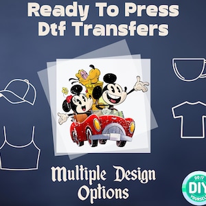 May include: Ready to Press DTF Transfers with multiple design options featuring Mickey Mouse, Minnie Mouse, and Goofy in a red car.  The image includes a white t-shirt, a white baseball cap, a white tank top, and a white coffee mug.