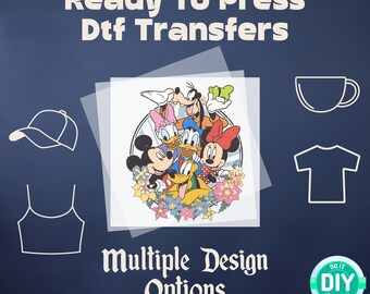 May include: Ready to Press Dtf Transfers with multiple design options featuring a group of Disney characters including Mickey Mouse, Minnie Mouse, Donald Duck, Goofy, and Pluto. The characters are surrounded by flowers and are on a clear sheet of transfer paper. The text "Do It Yourself" is in a blue circle with a white background.