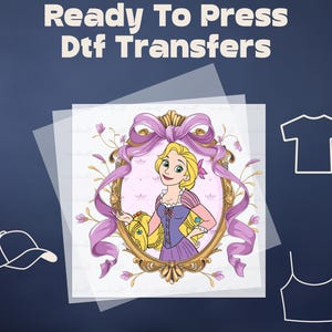 May include: Ready to Press Dtf Transfers featuring a cartoon image of a princess in a purple dress and yellow hair, standing in a gold frame with a pink ribbon. The image is on a clear sheet of transfer paper.