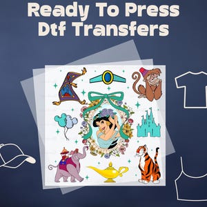 May include: DTF transfers featuring Aladdin characters, including Jasmine, Abu, Rajah, and the magic carpet. The image includes a variety of designs, such as a magic lamp, a castle, and a decorative frame. The text "Ready To Press Dtf Transfers" is at the top.