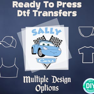 May include: Ready to press DTF transfers with a design of a blue car with the name Sally and the word Cars. The design is on a clear sheet with a white background. The image also shows a hat, a tank top, a mug, and a t-shirt.