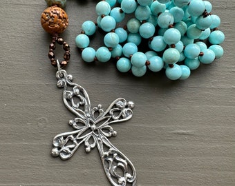 handmade long beaded necklace on turquoise with sterling vintage cross