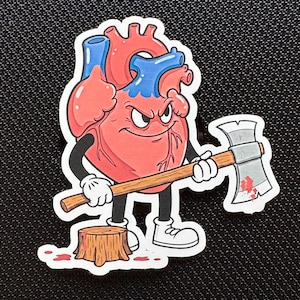 May include: A cartoon heart with an angry expression holds an axe over a tree stump. The heart is red with blue veins and has a white outline. The axe is silver with a wooden handle. There are red splatters of blood on the ground and the axe.