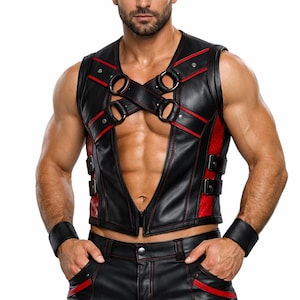 May include: Black leather vest with red accents, featuring a crisscross design with metal rings and a zipper closure. Matching black leather shorts with red trim and a buckle detail. Black wrist cuffs complete the ensemble.