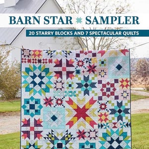 May include: A quilt featuring a variety of colorful star-patterned blocks with the text BARN STAR SAMPLER 20 STARRY BLOCKS AND 7 SPECTACULAR QUILTS and the author name SHELLEY CAVANNA printed on the cover of this instructional book.