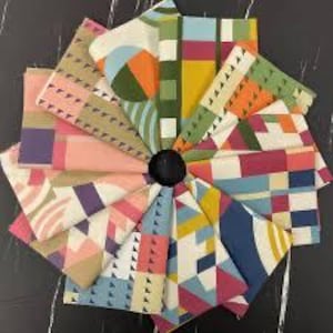 May include: A collection of fabric swatches arranged in a circular fan pattern, each featuring distinct geometric patterns and a vibrant color palette including mustard yellow, teal, coral, pink, navy blue, and olive green on a white background.