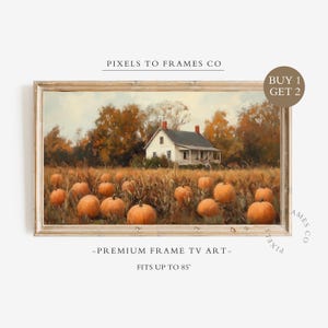 May include: A rectangular framed digital artwork titled PIXELS TO FRAMES CO, featuring a white farmhouse in a pumpkin patch with orange pumpkins and autumn trees. The text reads BUY 1 GET 2, PREMIUM FRAME TV ART, and FITS UP TO 85 inches.