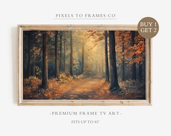 Op de afbeelding: Een rechthoekig digitaal kunstdisplay voor een televisie met een bosscène met hoge bomen, gouden zonlicht en herfstbladeren. De lijst is van licht hout. Tekst: PIXELS TO FRAMES CO, BUY 1 GET 2, PREMIUM FRAME TV ART, FITS UP TO 85".