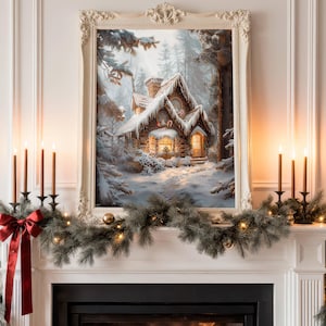 May include: A framed painting of a snow-covered cottage with lit windows hangs above a fireplace. The mantelpiece is decorated with a garland, candles, and a red bow. The painting is in a white ornate frame.