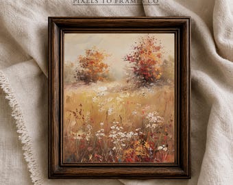 Puede incluir: Un cuadro de paisaje enmarcado que muestra un campo de flores silvestres en tonos dorados, naranjas y blancos, con dos árboles al fondo. El marco de madera marrón oscuro muestra el texto PIXELS TO FRAMES CO, HIGH-RESOLUTION, INSTANT DOWNLOAD.