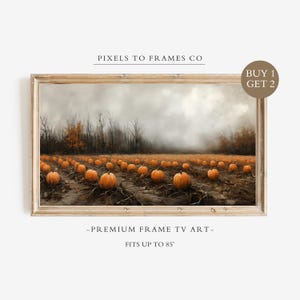 May include: A rectangular digital art display for a television featuring a landscape of a pumpkin patch under a cloudy sky. The text PIXELS TO FRAMES CO, BUY 1 GET 2, and PREMIUM FRAME TV ART FITS UP TO 85" are visible on the frame and image.