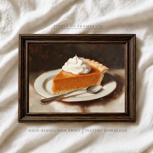 Puede incluir: Una impresión artística enmarcada que muestra una pintura de una porción de tarta de calabaza con nata montada en un plato blanco y una cuchara de plata. El texto PIXELS TO FRAMES CO, HIGH-RESOLUTION PRINT e INSTANT DOWNLOAD es visible.