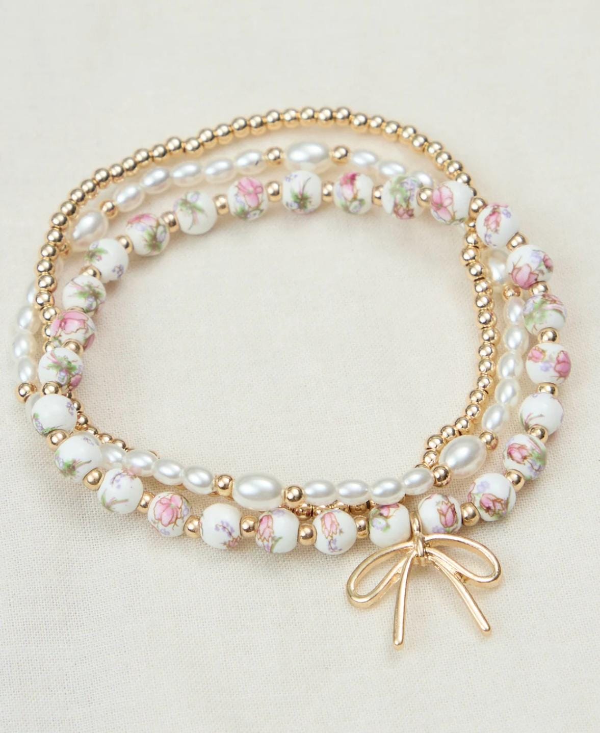 Bracciale rigido con fiocco, oro | Intrend