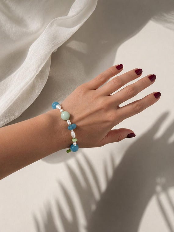 Pearl bracelet with aquamarine, coral , jade, quarts