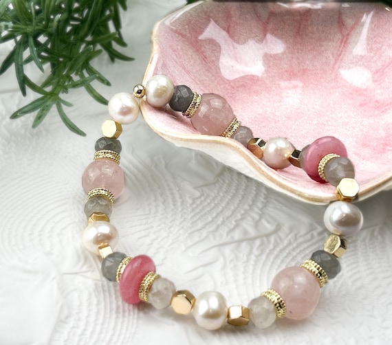 Coral pink pracelet in boho  style made from various natural gemstones and gold plated beads