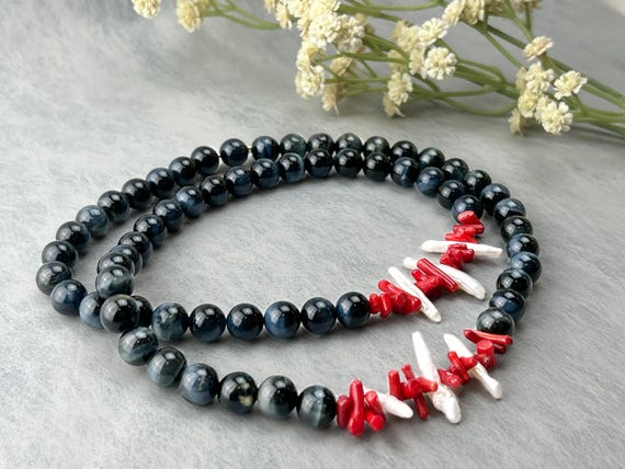 Modern long black necklace with red coral