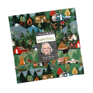 May include: A square stack of fabric squares featuring a forest theme with mountains, pine trees, mushrooms, and camping gear. A central label displays the text "moda paperTrails by CATHE HOLDEN" and includes a portrait of a person.