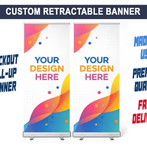 May include: Two custom retractable banners with a colourful abstract design. The banners read "Your Design Here" and are labelled "Blockout Roll-Up Banner." Additional text includes "Made in USA," "Premium Quality," and "Fast Delivery."