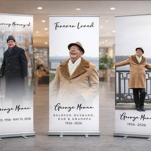 May include: Three roll-up banners with photos of a man. The banners read "In Loving Memory of," "Forever Loved," and "George Monan." The banners include dates and titles such as "Beloved Husband, Dad & Grandpa."
