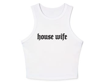 May include: White crop top with a scoop neck and the words "house wife" printed in black gothic font. The sleeveless top is made of a soft, lightweight material.