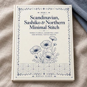 May include: A hardback book with a cream-coloured cover featuring dark blue text and illustrations. The title reads Scandinavian, Sashiko & Northern Minimal Stitch. It includes a floral graphic, a geometric pattern, and the author name Ridvan Yusein.