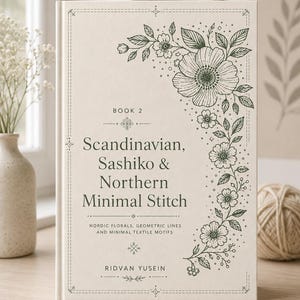 May include: A hardback book with a cream-coloured cover featuring dark green line art of floral motifs along the right side. The text reads: BOOK 2, Scandinavian, Sashiko & Northern Minimal Stitch, NORDIC FLORALS, GEOMETRIC LINES AND MINIMAL TEXTILE MOTIFS, RIDVAN YUSEIN.
