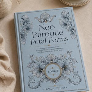 May include: A light blue hardcover book titled Neo Baroque Petal Forms, Book 3 by Ridvan Yusein. The cover features intricate dark blue floral and scrollwork illustrations, with the subtitle Contemporary Baroque Petals, Sculptural Florals, Ornamental Blossoms and Modern Decorative Textile Motifs.
