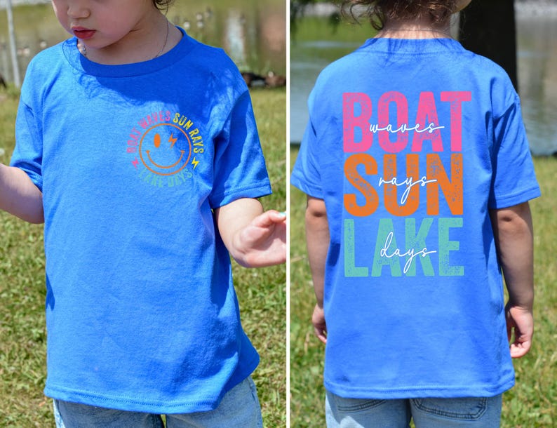 May include: A blue t-shirt featuring a smiley face and the words "Sun Rays & Sunny Days" on the front. The back of the shirt displays the words "Boat Waves Sun Rays Lake Days" in different colours.