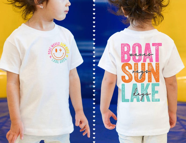 May include: White t-shirt with a summer-themed design. The front has a smiley face graphic and the words "Boat Waves Summer Lake Days." The back displays "Boat Waves Sun Rays Lake Days" in pink, orange, and teal.