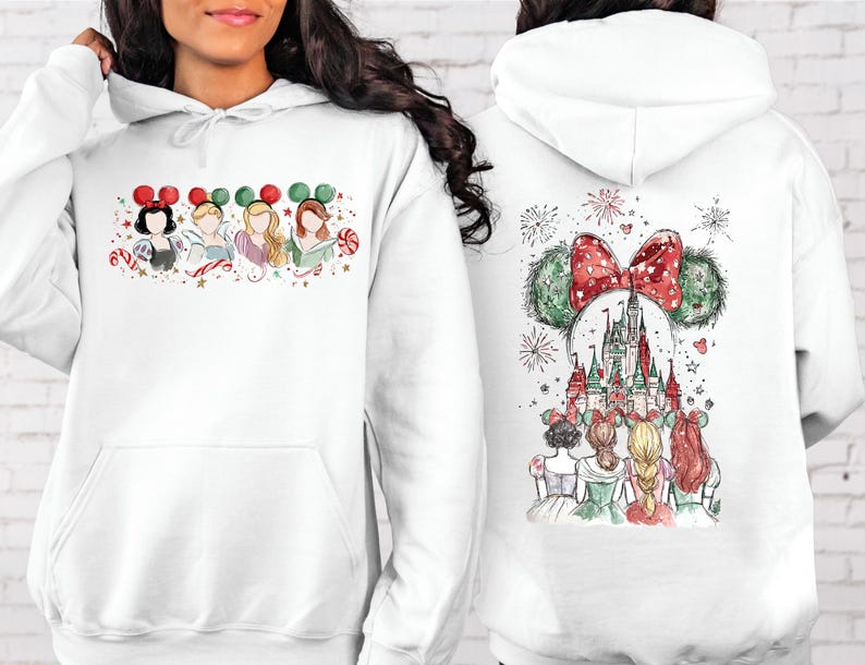 May include: White hooded sweatshirt featuring a watercolor design of Disney princesses wearing Mickey Mouse ears. The front shows four princesses, while the back displays a castle and fireworks with a Mickey Mouse ear design.