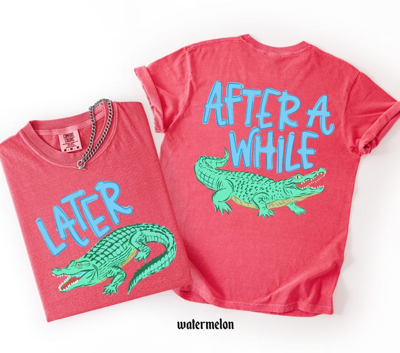 May include: Two red t-shirts with the text "LATER" and "AFTER A WHILE" in blue, along with a green alligator graphic. The shirts are made of a soft material and are a watermelon color.