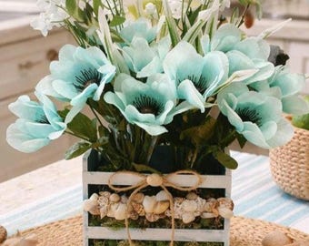 Blå och vit havssnäcksblomdisplay