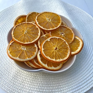 All-natural dried orange slices perfect for crafts, cocktails, potpourri, holiday décor, garnishes, and creative DIY projects.