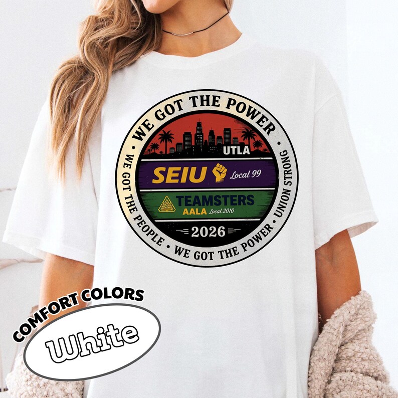 May include: White t-shirt with a circular graphic featuring the text "WE GOT THE POWER" and "WE GOT THE PEOPLE." The graphic includes a cityscape, palm trees, and the text "UTLA," "SEIU Local 99," and "TEAMSTERS AALA Local 2010." The year "2026" is also displayed.