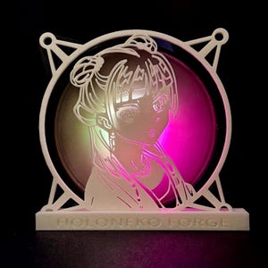 May include: A white, illuminated anime-style character art piece. The design features a female figure within a circular frame, with a pink and green gradient light in the background. The base of the piece reads "HOLONEKO FORGE".