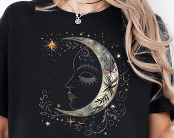 Camiseta feminina estilosa com estampa da lua | Camiseta vintage • Camiseta com design celestial inspirado na astrologia • Estampa de lua crescente e estrelas • Whimsigoth