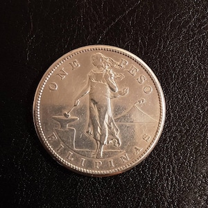 1907S Philippines one Peso coin.  80% silver.  Better condition.  Item #A16