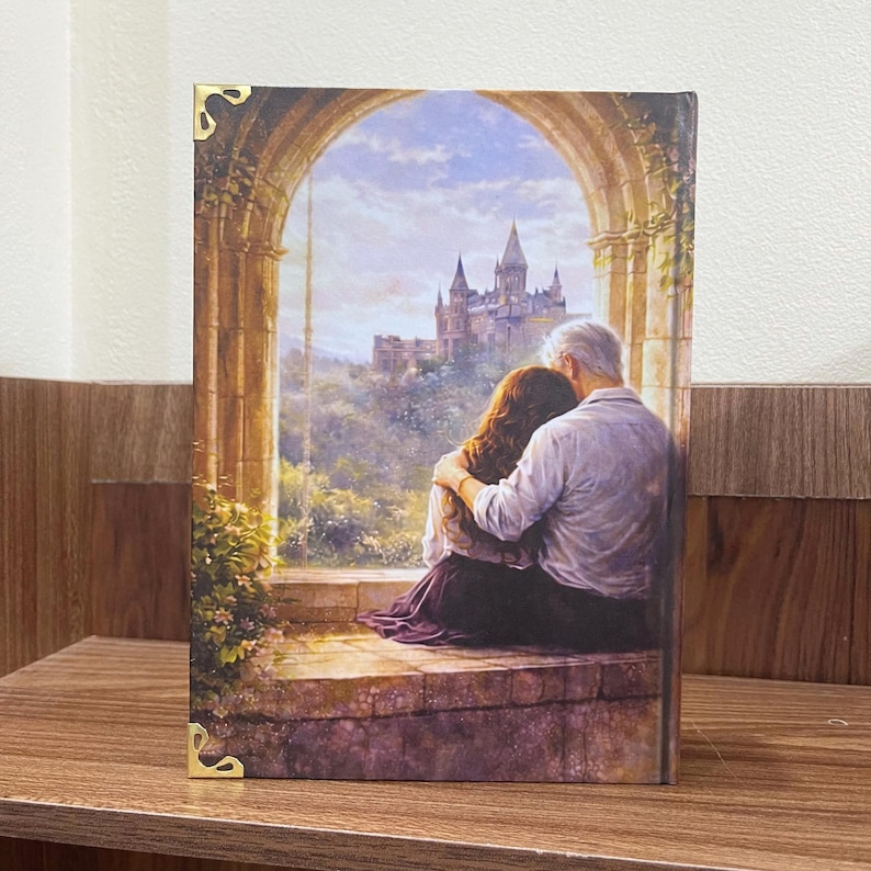 May include: A rectangular art print featuring a couple embracing, overlooking a castle. The artwork is framed by an arched window with a stone ledge. The color palette includes blues, greens, and browns, creating a romantic scene.