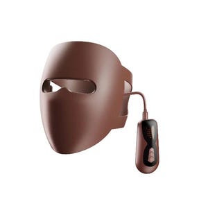 Peut inclure: Un masque facial de luminothérapie LED marron avec un boîtier de commande séparé. Le masque a des trous pour les yeux et une sangle pour s'adapter à la tête. Le boîtier de commande a un écran numérique et des boutons.