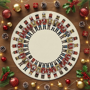 May include: Circular cream-colored Christmas mat featuring a ring of illustrated nutcracker soldiers in red, gold, and black uniforms. The mat is surrounded by Christmas ornaments, pine cones, and holly on a wooden surface.