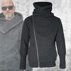 Svart fleecehuvtröja: Asymmetrisk dragkedja, tumhål, generös stor huva