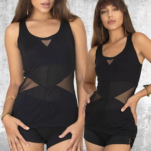 May include: Two women wearing black tank tops with sheer mesh panels. The tops have a scoop neck and a triangular mesh panel at the neckline. The women are wearing black shorts.