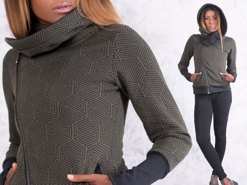 May include: A green and black geometric patterned zippered jacket with a high collar and a hood.